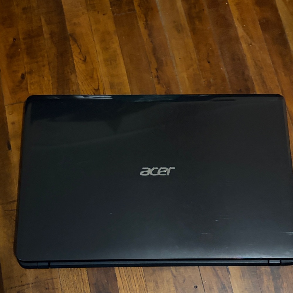 Acer Black Laptop with Silver Logo